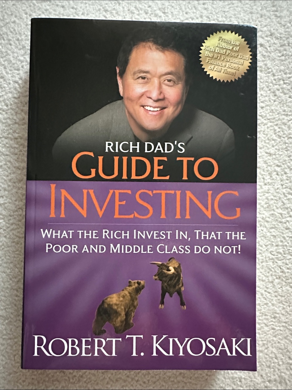 Rich Dad's Guide to Investing by Robert T. Kiyosaki - Purple & Black Cover